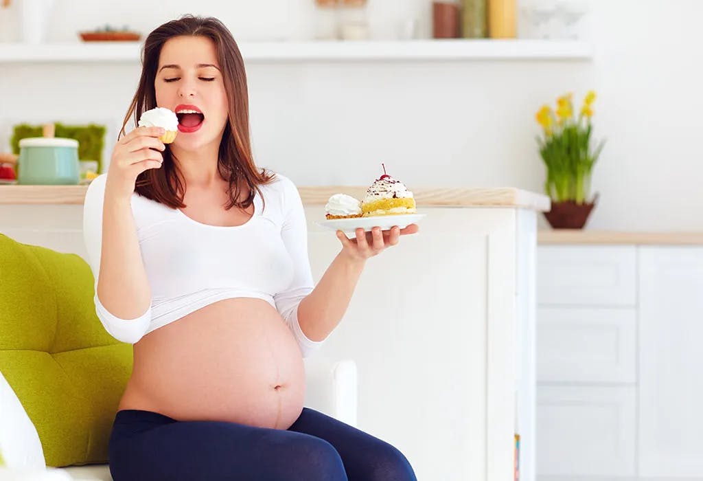 Pregnant woman looking at a plate of food with a question mark