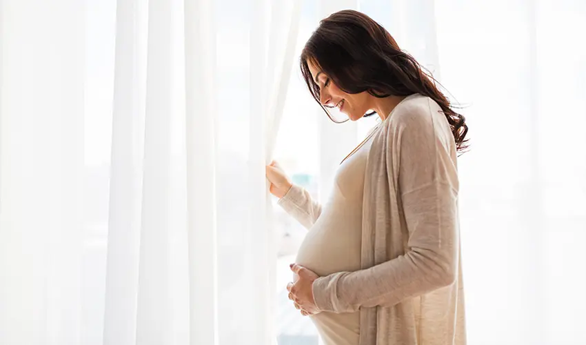 A colorful array of pregnancy-friendly foods arranged on a weekly meal planner