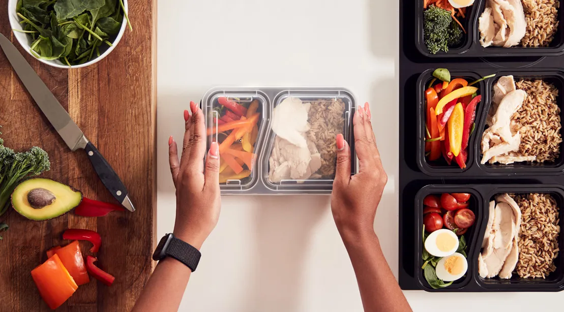 Pregnant woman preparing a healthy meal in the kitchen